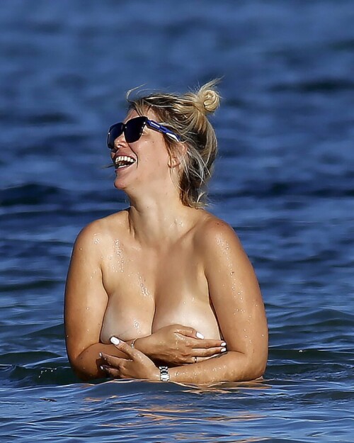 Wanda Nara goes all out in Ibiza, flaunting her big sexy breasts with a daring hand bra and a barely-there thong bikini. The beach has never been hotter!